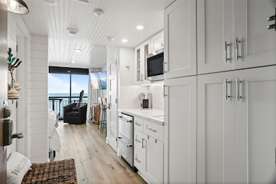 You're looking at a sleek, modern kitchen with whi