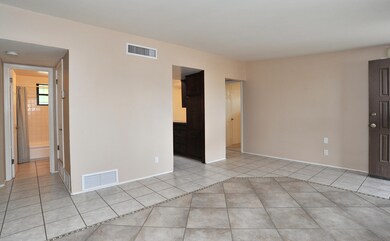 Neutral tile throughout