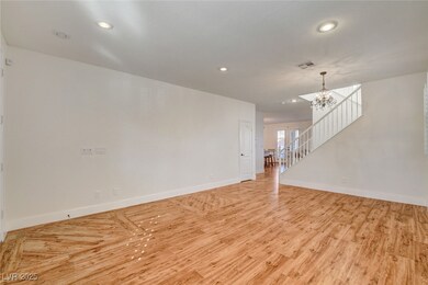 Empty room with a chandelier, recessed lighting, a