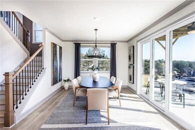 Dining room with ornamental molding, baseboards, a