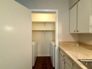 Laundry area with washing machine and dryer and d