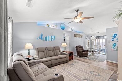 featuring vaulted ceiling, with remote controlled colored mood lighting, ceiling fan