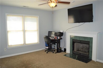 Family room has wonderful natural light and gives separation from the living room for families to utilize in multiple ways.