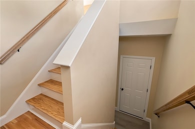 Spit entry with hardwood stairs.