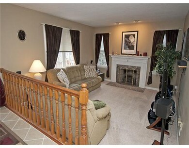 Family Room. Eyeball lights overlook the gas log f