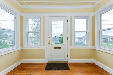 Enclosed porch gives a buffer against inclement we