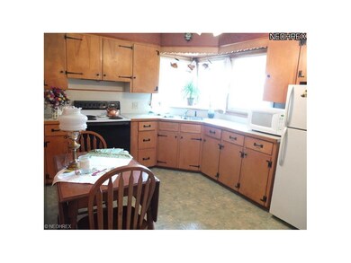 Eat-in, applianced kitchen.