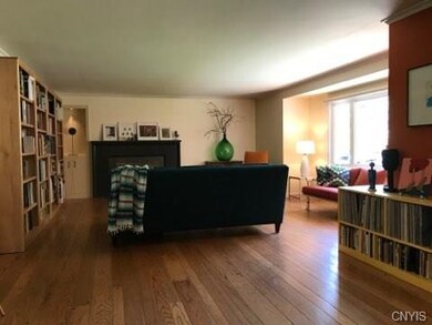 Looking into living room-  wood burning fireplace 