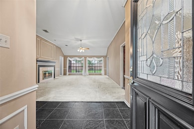 Welcome home! An elegant leaded-glass front door o