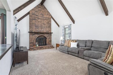 Large Great Room with a massive brick fireplace, a