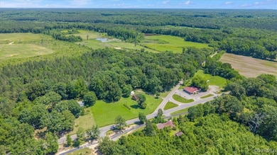 View of property location featuring a forest