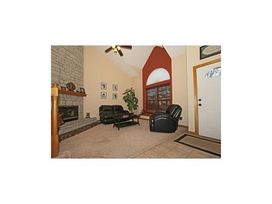 Comfortable living room with tile and carpet floor