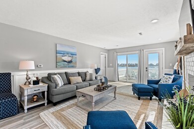 Living room featuring a brick fireplace, a texture