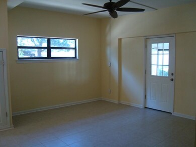 Family Room off the kitchen and leading to sunroom