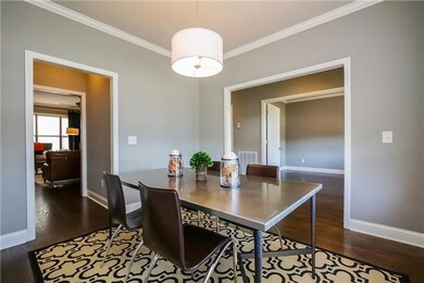 Upon entering you are greeted by a beautiful dining room, as well as an office or formal living room with double doors.  Notice the crown, hardwoods, lighting, and fixtures throughout.
