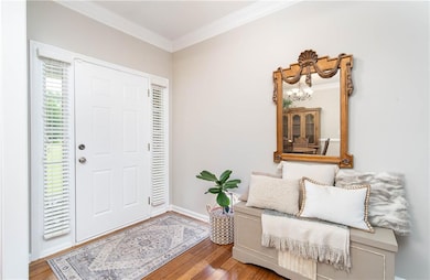Wide open Foyer entrance featuring a direct view to the living room