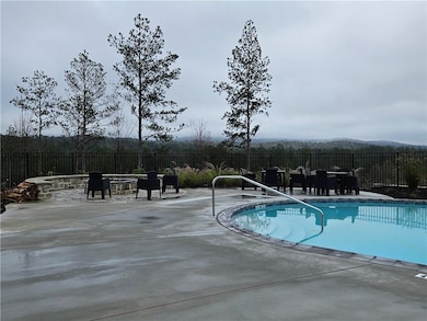 View of pool featuring a patio, a fenced backyard,