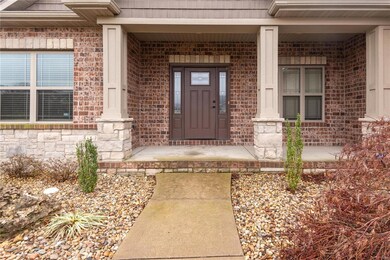 Entrance to property featuring a porch