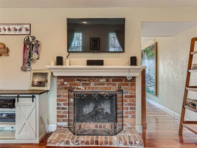 wood burning fireplace and tv mounted above!