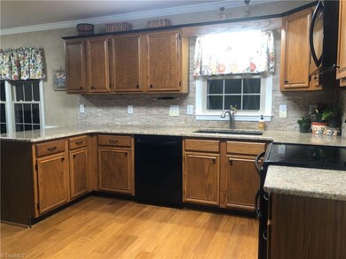 Nice bright kitchen with granite counter tops