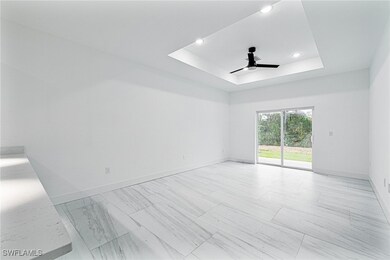 Spare room featuring baseboards, a ceiling fan, re