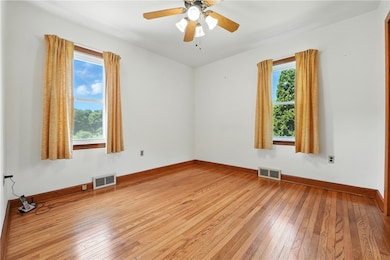 1st bedroom 10x11, with original hardwood floors