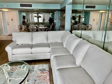 Living room featuring a textured ceiling and hardw