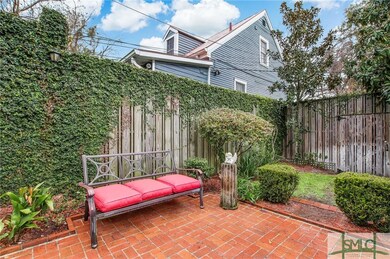 Classic courtyard w/privacy fence. This property e