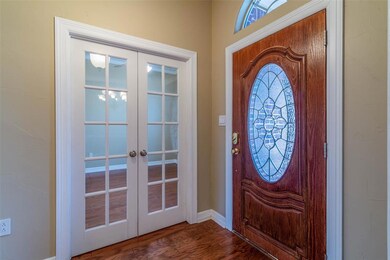 Double doors to multi-purpose room. Could be Office, 4th bedroom, 2nd living, library, ect.