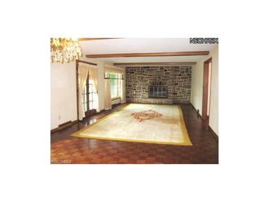 LIVING ROOM WITH PARQUET FLOOR, STONE FIREPLACE & 