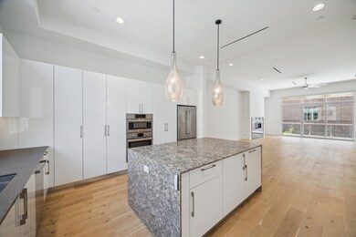 Gourmet kitchen touts Madeval modern cabinetry, Bo