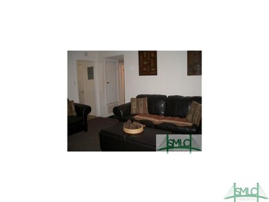 Living room with access to kitchen and bedrooms