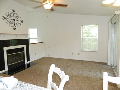 Vaulted Great Room with Wood Burning Fireplace and