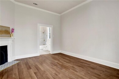 Unfurnished living room with wood finished floors,