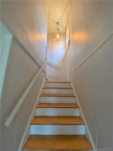 Staircase leading to upper lever main living area.
