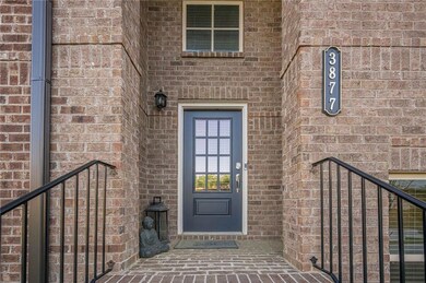 Doorway to property with brick siding