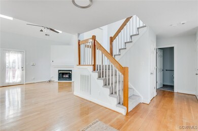 Unfurnished living room with ceiling fan and light
