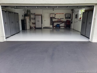 Double car garage with epoxy floor and freshly pai