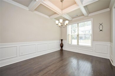 Unfurnished dining area with dark wood-style floor