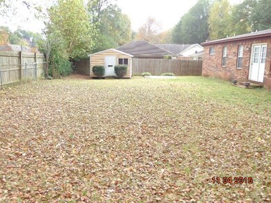Rear yard and storage building/workshop.