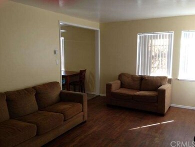 The open and inviting living room has original har