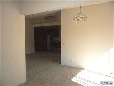Dining El view into Living room and Kitchen