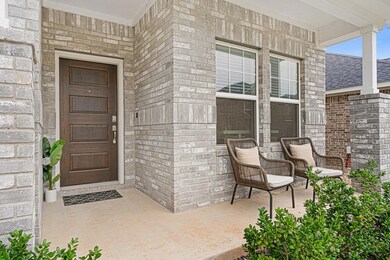 Entrance to property featuring brick siding and a