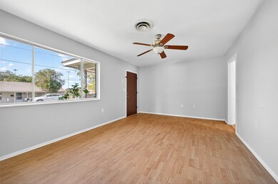 Spare room featuring light wood-type flooring and a ceiling fan