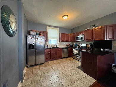 updated kitchen with stainless steel tile flooring