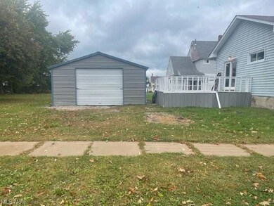 Garage featuring a yard