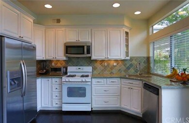 Straight on picture of kitchen area showing wood f
