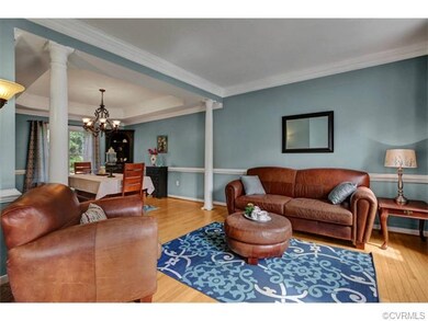 Formal living room opening into dining room