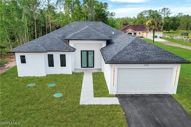 View of front of property featuring a shingled roo
