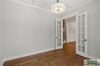 Enter the double French doors across from the dini
